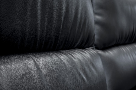 close up Black leather sofa - Fragment of expensive leather sofa, genuine leather Sofaの写真素材