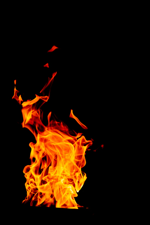 yellow and orange and red Fire flame isolated on black isolated backgroundの写真素材