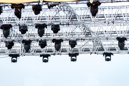 Illuminated multi-colored lights LED lights equipment attached to constuction steel frame. on...
