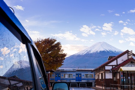 Yamanashi, JAPAN -  21 NOV. 2016,  fuji mountain on blue sky and reflec on car door at Kawaguchiko Station, Yamanashi, Japan. the sacred mountain of Fuji and symbolic of Japaneseのeditorial素材