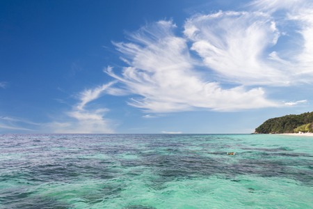 Beautiful tropical blue sky sea and blue sky and white cloudsの写真素材
