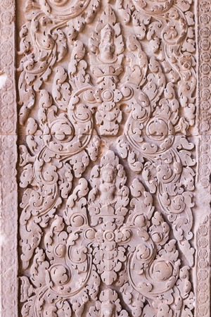 Cambodia traditional art Carved reliefs on the walls of sandstone, angkor wat hindu style temple carvingsの写真素材