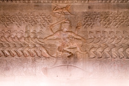 Scene of the Churning of the Milk Ocean carvings status on the wall of Angkor wat temple, world heritage, Siemreap, Cambodiaの写真素材