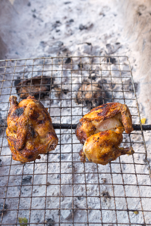 grilled chicken thai style on display street food shop in thailandの写真素材