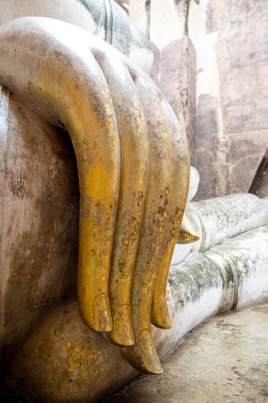 close-up finger ancient buddha statue (Phra Achana) in Wat Si Chum (Buddhist temple). Sukhothai Historical Park, Sukhothai, Thailandの写真素材