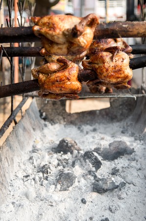 grilled chicken thai style on display street food shop in thailandの写真素材