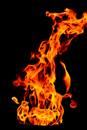Fire flame isolated on black isolated background - Beautiful yellow, orange and red and red blaze fire flame texture style.の写真素材