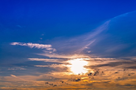 sunset/sunrise sky with light beam pass clouds and sky backgroundの写真素材
