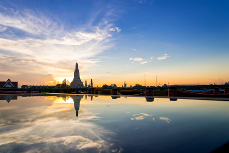 Sunset Wat Arun (Temple of Dawn) and Reflections of Wat Arun Pagoda on glass table is landmark of Attractions's Popular tourists, in bangkok Thailandの写真素材
