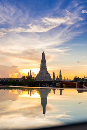 Sunset Wat Arun (Temple of Dawn) and Reflections of Wat Arun Pagoda on glass table is landmark of Attractions's Popular tourists, in bangkok Thailandの写真素材