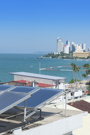 Solar Collector / Solar water heating system on the roof hotel  with landscape of sea view at Pattaya bay, pattaya city, Thailandの写真素材