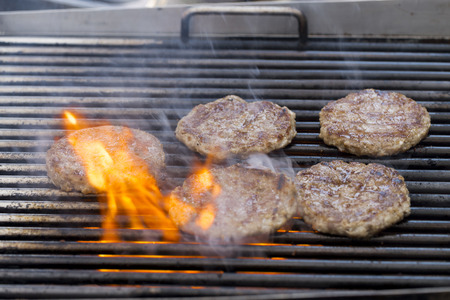 Grilled meat / pork burgers, grill, smoke and light aroma - Cooking grill burgers processの写真素材