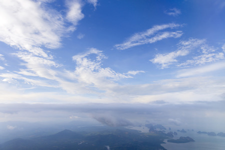 Aerial view from window air plane and top views of Phang Nga Bay and blue sky and cloud, phuket island before landing at Phuket, thailandの写真素材