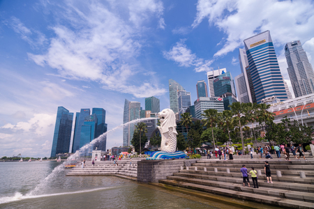 SINGAPORE, SINGAPORE - 31 MAY 2014 : The Merlion and Singapore city skyline at the marina bay in singapore, The Merlion statue is a symbol of Singapore city landmark.のeditorial素材