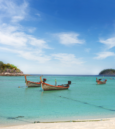longtail boat in beautiful crystal clear sea with blue sky sunshine at beach Lipe island, tropical island on Andaman sea in 
Satun,Thailandの写真素材