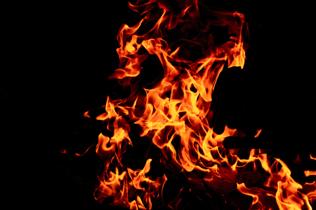 Fire flame isolated on black isolated background - Beautiful yellow, orange and red and red blaze fire flame texture style.の写真素材
