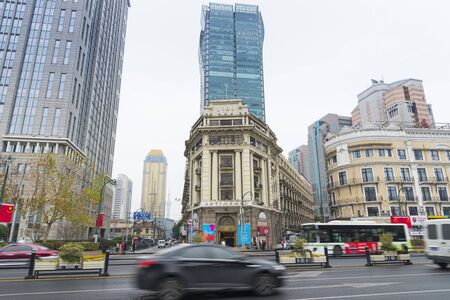 SHANGHAI, CHINA - Dec. 28, 2017: Historical architecture on East Nanjing Road - the main shopping street of Shanghai city, China after rainのeditorial素材