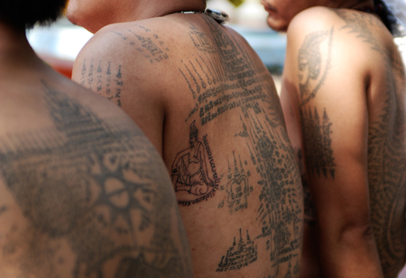 WAT BANG PHRA, Nakhon Prathom, THAILAND - FEB 27 2010: Thai  traditional  tattoo (Yantra) on Unidentified body's adherent during Memorial ceremony Master Day Wat Bang Pra, Thailand.のeditorial素材