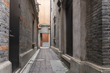 Narrow alley with antique brick walls, Xintiandi and Shanghai Shikumen building style in the French Concession area of Shanghai, Chinaの写真素材