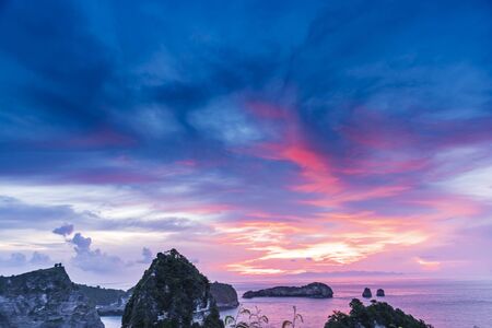 Early morning sunrise with View of cliff Nusa Penida Island, Bali, Indonesia. Azure beach, rocky...