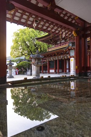 Fukuoka, Japan - May 4 2019 : Tourists and local people visits  Dazaifu Tenmangu Shrine, reflex in water in Dazaifu city, Fukuoka, Kyushu, Japanのeditorial素材