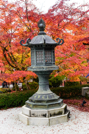 Kyoto, Japan - Nov 25, 2016. beautiful autumn garden with ancient lanterns and color of Japan maple leaves  on tree at the park at Eikando shrine in Kyoto, Japan.のeditorial素材