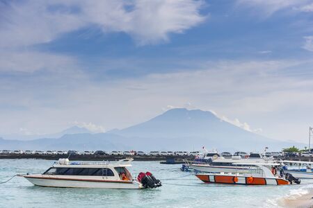 volcano Agung mountains of Bali view from nusa penida and sea and beach with car piar's penida...