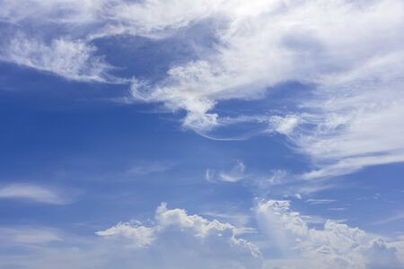 Blue sky and white fluffy tiny clouds background and patternの写真素材