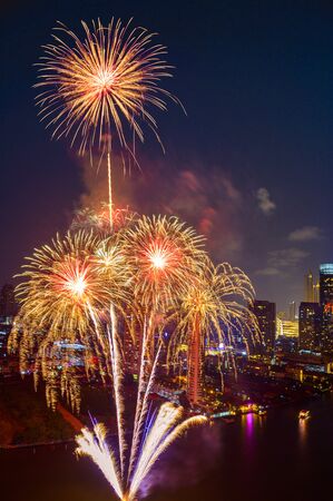 Beautiful firework display for celebration happy new year and merry christmas with  Twilight night and firework lighting in bangkok cityscape background, Thailand.の写真素材