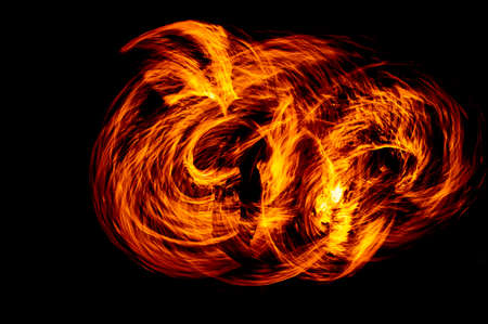 Circle of Fire flame with movment isolated on black isolated background - Beautiful yellow, orange and red and red blaze fire flame texture style.の写真素材