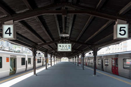Retro wooden railway platform and Mojiko station sign at Mojiko station, Kitakyushu, Japanのeditorial素材