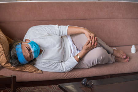 Asian senior woman living alone and sleep with chills, fever without family take care.の写真素材