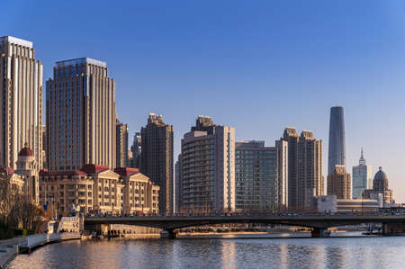 waterfront downtown skyline with Tianjin high-rise building cityscape at Haihe riverside, Tianjin city, Chinaの写真素材