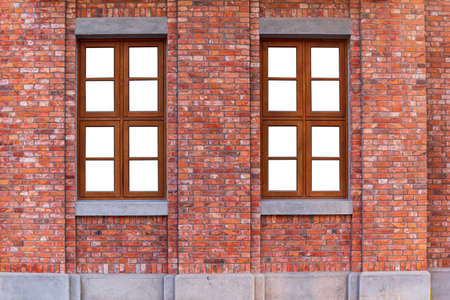 Vintage orange brick wall and wood window with white glassの写真素材