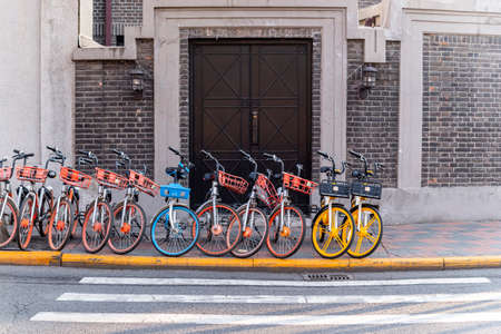 Tianjin, CHINA - 27 Decumber 2019: :Row of parking  lot of sharing bicycles on downtown road in Tianjin city, Chinaのeditorial素材