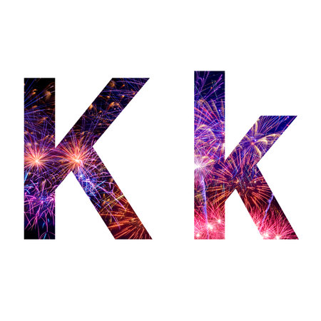 Letter k made from celebration happy new year and merry christmas firework isolated on black isolated backgroundの写真素材