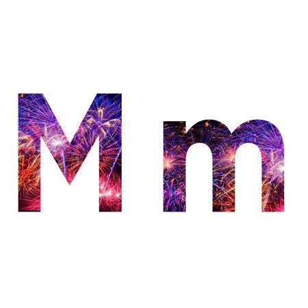 Letter M made from celebration happy new year and merry christmas firework isolated on black isolated backgroundの写真素材