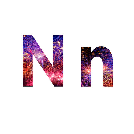 Letter N made from celebration happy new year and merry christmas firework isolated on black isolated backgroundの写真素材