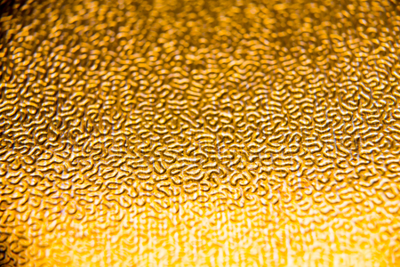 texture of the gold embossing of cardboard close upの写真素材