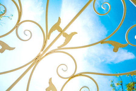 White Wrought iron steel art roof with blue sky