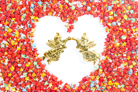 red star paper heart shape on white background with angelの写真素材