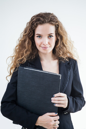 beautiful young business woman holding folder or Document file  on white blackgroundの写真素材
