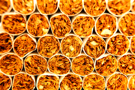 Heap of Tobacco Cigarettes, stack as a background texture close up の写真素材