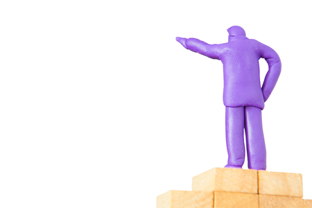 plasticine businessman commanding on wooden base on white background with clipping pathの写真素材