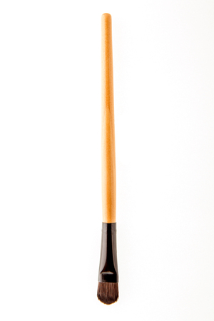 cosmetic makeup brush on white blackground close upの写真素材