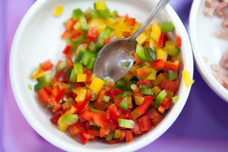 slices of green, yellow and red bell pepperの写真素材