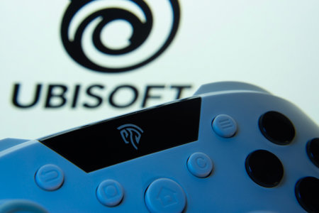 Dhaka, Bangladesh- 14 Nov 2025: A close-up of a gamepad with the Ubisoft seen on screen in the...