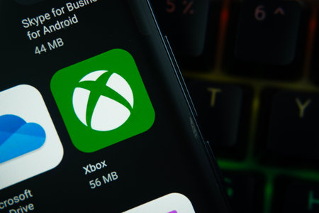 Dhaka, Bangladesh- 27 July 2025: Close-up of smartphone screen showing the Xbox app icon with a dark interface.のeditorial素材