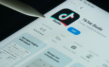Dhaka, Bangladesh- 30 Oct 2025: tiktok Studio app on a iPad screen with a pen pointing at the...