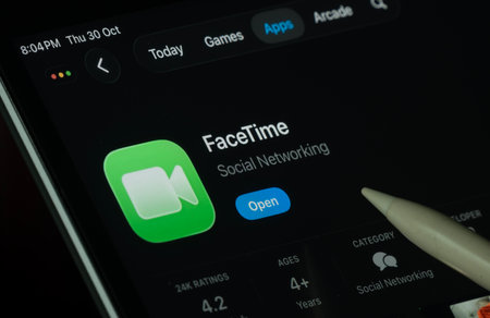Dhaka, Bangladesh- 30 Oct 2025: Apple Facetime app displayed on a iPad screen in dark mode with a digital pen pointing at it.のeditorial素材